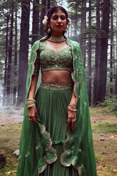 Fern green layered lehenga with embroidery on the waist. Comes with embroidered blouse and dupatta.
Component: 3
Pattern: Embroidery
Type Of Work: Mirror, Sequin and Cutdana
Neckline: Leaf
Sleeve Type: Half
Fabric: Crepe and Tissue
Color: Green
Other Details: 
Padded blouse
Dupatta with embroidered scallop border
Closure: Back zip
Occasion: Sangeet - Aza Fashions Green Lehenga With Intricate Embroidery For Festive Occasions, Green Lehenga With Traditional Drape For Festive Season, Festive Green Lehenga With Intricate Embroidery, Bollywood Style Green Lehenga For Festive Occasions, Green Saree Set With Intricate Embroidery, Green Lehenga With Unstitched Blouse For Navratri, Bollywood Green Lehenga With Intricate Embroidery, Green Designer Lehenga For Eid, Green Bollywood Style Choli For Designer Wear