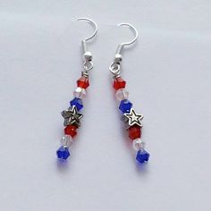 This listing is for one pair of Patriotic Star Spangled Dangle Earrings. Choose a Star or a Heart Center Bead. Earrings are made with crystal/glass beads and silver toned beads attached to lead/nickel free silver plated hooks. The length of earrings is approximately 2 inches. Please contact me for requests, quotes and/or larger quantities. Earrings come in a colorful organza pouch. Gift box may be purchased if sending as a gift. May also include a note to recipient if desired (no extra charge). Blue Diy, Patriotic Earrings, Patriotic Jewelry, Heart Center, Earrings Star, Unique Keychains, Jewerly Making, Organza Pouch, Rhinestone Transfers