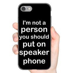 a person holding up a phone case with the words i'm not a person you should