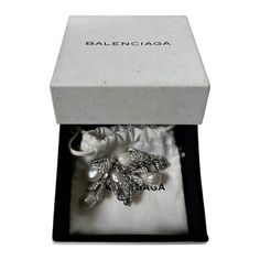 condition 9/10 color silver one size total length 19cm comes with card, dust bag and box free shipping worldwide (takes around 5days) Luxury Silver Jewelry With Original Box, Designer Silver Jewelry With Original Box, Designer Silver Jewelry In Original Box, Balenciaga Bracelet, Swarovski Crystal Bracelet, Crystal Bracelet, Baroque Pearls, Crystal Bracelets, 9 And 10