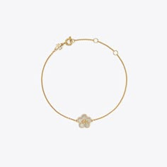 Featuring a mother-of-pearl flower and our signature Double T, the Kira Bracelet is perfect for every day. Elegant White Bracelets With Flower Charm, Elegant White Gold Bracelet With Flower Charm, Luxury Flower-shaped Bracelets As Gift, Luxury Flower Charm Jewelry, Tory Burch Bracelet, Tory Burch Kira, Designer Bracelets, Pearl Flower, Flower Bracelet