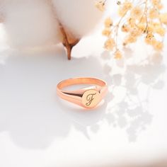 Elevate your ring game (or find the perfect anniversary gift) with our  Personalized Signet Ring. This timeless piece features a smooth, polished  surface waiting to be customized with your initials or a special symbol.  Crafted from your choice of gleaming gold or sleek silver, this dainty signet  ring is perfect for stacking with other favorites or wearing solo for a touch  of classic elegance. Super Features: * Tell Your Story: Personalize it with your initials, a meaningful  symbol, or even Personalized Rose Gold Signet Promise Ring, Rose Gold Tarnish Resistant Rings For Gift, Rose Gold Tarnish-resistant Rings For Gift, Rose Gold Signet Ring With Initials For Gift, Rose Gold Tarnish Resistant Signet Ring As Gift, Engraved Rings For Valentine's Day, Personalized Rose Gold Open Signet Ring, Rose Gold Engraved Ring With Name For Gift, Rose Gold Engraved Name Ring As Gift