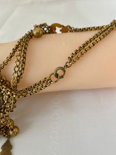 "Etruscan Revival Festoon Necklace and Bracelet Set Gold Tone Ornate Vintage Patina Necklace - 16.5\" plus festoon drop with dangles additional 4\" Length Bracelet - 7.5\" Bracelet medallion 1.76x x 1.50@ No markings Aged patina, can use white vinegar to brighten if preferred" Metal Bracelets With Latkans For Festival, Bohemian Metal Bracelets With Latkans, Vintage Dangle Jewelry With Latkans, Vintage Metal Jewelry With Latkans, Festive Bohemian Jewelry With Adjustable Chain, Bohemian Bracelet Jewelry With Latkans, Bohemian Bracelet With Latkans, Adjustable Bells Jewelry For Festivals, Adjustable Festival Jewelry With Bells