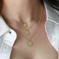 The Chiara necklace is a light gold round disc necklace that you just NEED. Wheather you wear it alone or stacked, with your another necklace or bare alone- it's perfect. Add a personal touch to your Chiara necklace with an engraved portrait of a loved one on one side and their name engraved on the opposite side. If you can dream it- we can make it happen. All features can be customized! Talk to us, we love making custom designs. Our jewelry is carefully handmade in our atelier To order by phone call +972(0)722991000 Round Sterling Silver Medallion Necklace, Everyday Round Medallion Necklace, Everyday Delicate Chain Coin Necklace, Everyday Coin Necklace With Delicate Chain, Gold Minimalist Medallion Pendant Necklace, Elegant Circular Coin Pendant Charm Necklace, Minimalist Yellow Gold Medallion Pendant Necklace, Minimalist Yellow Gold Round Medallion Necklace, Minimalist Gold Medallion Pendant Necklace