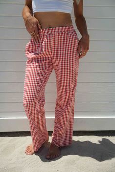 Score trendy Gingham Pants made of cotton canvas in a red check pattern. Designed with a comfy fit and a low waist, these bottoms will elevate your look when worn with a top and stylish boots or heels. pants 50% cotton 50% polyester lininig 100% rayon gingham print inner drawstring tie elastic waistband double pocket at back non stretch fully lined models are both wearing size medium Casual Gingham Trousers, Summer Gingham Straight Leg Bottoms, Red Bottoms For Spring Picnic, Red Spring Bottoms For Picnic, Casual Gingham Cotton Bottoms, Plaid Cotton Bottoms For Picnic, Red Bottoms For Summer Picnic, Red Summer Bottoms For Picnic, Cotton Gingham Bottoms For Loungewear