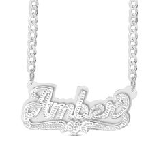 This personalized diamond accent plate necklace spells out your name in an artful way. Sterling silver Features your name - from three to 10 characters in length - sculpted in a stylish script font Scrolling ribbons and a diamond-accented heart shine below Hammered finish Polished plate background 18.0-inch curb chain necklace; lobster claw clasp Custom Name White Gold Nameplate Necklace, Custom Engraved Silver Nameplate Necklace, White Gold Nameplate Necklace With Names, Silver Customizable Nameplate Necklace, Silver Nameplate Custom Necklace, White Gold Nameplate Necklace, Engraved White Gold Nameplate Necklace, Silver Custom Nameplate Necklace, Custom Silver Nameplate Necklace