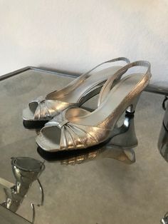 Banana Republic Sling Silver Slingback  Heel Sandals 8 M Pre-owned, good condition. Textile upper, leather and lining-leather.  They are not worn, may be once inside as you can see on the pic. Silver covered textile upper seems distressed or scratched throughout but it is not a sign of wear as i own them and did not have a chance to wear. Silver Open Toe Slingback Sandals For Spring, Silver Open Toe Slingback Pumps For Summer, Silver Slingback Sandals For Summer, Silver Open Toe Slingback Pumps For Spring, Silver Open Toe Slingback Sandals With Padded Heel, Silver Open Heel Slingback Sandals For Summer, Silver Closed Toe Slingback Sandals For Evening, Silver Open Toe Leather Slingback Pumps, Silver Leather Open Toe Slingback Pumps