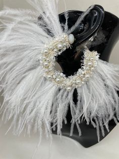 Dare to be Different  Large stunning unique earrings. Pearls and ostrich feather earrings. Clip on or pieced ears.Please advice Great idea for brides and special events. White full ostrich feather. Ivory and Off-white available. 1-2 day shipping. Delivery to USA within 10-20 working days Delivery to UK within 8-12 working days Delivery to Europe within 6-12 working days Delivery to the rest of the world within 10-22 working days. Faster options are available at check out, please remember to leav White Bohemian Evening Jewelry, White Feather Dangle Earrings, Bohemian Feather Earrings For Party, Elegant Silver Feather Earrings, White Bohemian Hoop Earrings For Party, Elegant Feather Dangle Earrings, Elegant Dangle Feather Earrings, Elegant Dangle Earrings With Feathers, Party Jewelry With Feather Dangles