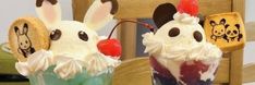 two ice cream sundaes decorated to look like bunnies with cherries in them