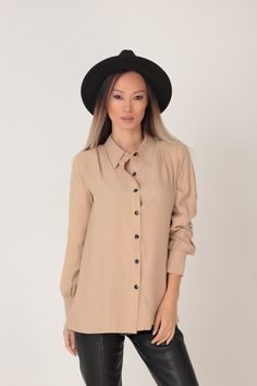 RELAXED BEIGE VISCOSE SHIRT WITH DOUBLE PANEL BACK Every order is sent out worldwide with EXPRESS 2-3 days delivery GARMENT FEATURES: * Relaxed silhouette * Great draping effect and soft touch feel * Beautiful cappuccino beige shade * Classic pointed collar * Double panel back with contrast black buttons in two rows * Front button fastening * Loose long sleeve fit with shirt cuffs SIZING & FITTING: Model is 175cm tall and wears size S. This piece is available in sizes XS-XXL. The outfit is s Beige Collared Office Shirt, Beige Button-up Office Shirt, Beige Button-up Shirt For Office, Beige Office Shirt With Buttons, Beige Buttoned Shirt For Office, Beige Button Closure Shirt For Business Casual, Business Casual Tops With Roll-up Sleeves And Shirttail Hem, Casual Beige Office Shirt, Casual Beige Office Top