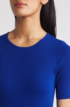 This lightweight, fine-gauge sweater provides a pop of color to perk up your everyday look. Jewel neck Short sleeves 72% rayon, 28% polyester Dry clean Imported Blue Fine Knit Sweater For Work, Classic Blue Textured Knit Top, Blue Workwear Top With Ribbed Neckline, Blue Fine Knit Sweater For Layering, Blue Crew Neck Sweater For Work, Blue Stretch Fine Knit Top, Classic Blue Tops For Layering, Blue Knit Top For Layering, Blue Textured Knit Top For Layering