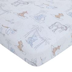 an image of a baby crib sheet with animals on it