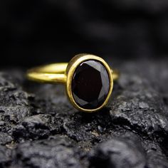 Black Onyx Dainty Stacking Ring | Gold Onyx Statement | 925 Sterling Silver | Handmade Black Gemstone Ring | Christmas Gifts Ring Our shop offer free ring sizing and color options. Handcrafted Hanmade  Ring Metal : 925 Sterling Silver Plating : 24K Gold Band Width : 2 mm Gem Stone : Onyx Gem Size : 11 X 9 mm  Ring Weight : 3.75 grams Ring Size : US 6 (The size you want is made for free). (We used the US standard sizing)  **Custom Orders is Made** As pellada family, we will be happy to help you if you contact us with the photo and dimensions of the design you want. To return back to Pellada Shop Home Page,Click here! https://www.etsy.com/shop/Pellada Thank you for shopping! Pellada Classic Oval Black Spinel Jewelry, Black Spinel Sapphire Ring Gift, Classic Black Sapphire Ring For Gift, Classic Black Sapphire Ring As Gift, Formal Black Ruby Ring, Black Ruby Ring Gift, Classic Black Spinel Ring Jewelry, Black Birthstone Rings, Black Round Rings With Bezel Setting