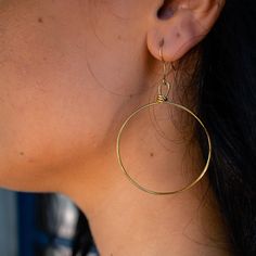 You won’t want to take these hoop earrings off - they are effortless, light and comfortable to wear all day and into the evening. These handmade earrings are perfect for everyday wear. This item is part of the “Hope Line” which consists of introductory pieces made by our new artisans, and tell a powerful story of fresh beginnings. The artisans first learn how to wrap while making these earrings! Included with your purchase of the brass Olivia Earrings will be a polishing cloth and instructions o Nickel-free Hoop Earrings For Everyday, Nickel Free Hoop Earrings For Everyday, Metal Open Circle Hoop Earrings, Everyday Small Hoop Earrings With Ear Wire, Hypoallergenic Open Circle Hoop Earrings For Gift, Gift Single Open Circle Hoop Earring, Nickel Free Circular Earrings, Handmade Drop Wrap Earrings For Everyday, Small Hoop Single Wrap Earring Gift