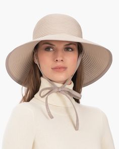 If you need a year round sun protection hat, consider this soft women's crusher of row on row spiral stitched grosgrain ribbon that will take you from summer into fall and back again. The gently downturned brim can be worn in a variety of positions, which flatters most face shapes. Self chin ties secure Ribbon Skimmer on the windiest of days, either under the chin or behind a ponytail in back. Simply tuck chin ties inside the hat's crown, when not in use. Brim Span: 4"(10.2cm) Highest sun protec Lightweight Spring Hat With Upf 50+, Lightweight Upf 50+ Hats For Spring, Lightweight Short Brim Sun Hat For Spring, Lightweight Wide Brim Hat For Spring, Spring Straw Hat With Upf 50+ And Lightweight, Lightweight Straw Hat With Upf 50+ For Spring, Lightweight Sun Hat With Curved Brim, Lightweight Sun Hat With Upf 50+ For Spring, Lightweight Upf 50+ Sun Hat For Spring