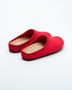 Description: The Nebraska Women's Wool Clog is an Italian take on a European classic. The women's Nebraska in red is one of the most versatile mule style slippers available. From home to the office to weekend, the minimalist design of these clogs will take you anywhere in comfort. The anatomical self-molding latex and thermoforming cork insole provide a firm customized comfort, and the insole is completely removable. LeClare Slippers are exclusively handcrafted in our small-batch factory in Trev