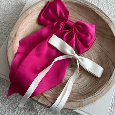 As the newest addition to our bow collection, the luxe silk bow does not disappoint. This oversized bow elevates and adds a pop to any holiday outfit. - Material: Satin - Size: 8.9(L) x 12.6(H) inches - Tight, clasping barrette closure - Designed with love in San Diego Shop the rest of our bow collection here FAQ click here Return Policy click here Elegant Summer Bow For Gifts, Chic White Bow For Party, Elegant Bow Tie For Spring Gifts, White Bow For Spring Party, Elegant Summer Ribbon Bow Tie, White Bow For Summer Parties, Elegant Summer Bow Tie With Ribbon, White Bow For Summer Party, Chic Detachable Bow For Summer