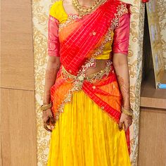 This Is A Pretty Half Saree And The Lehenga (Skirt) Is Yellow With Pink Border And The Waist Is A Tie Belt So It Would Fit From 26-32 Waist Range.The Blouse Is Stitched To The Size Small(Bust 32) But As You Can See In The Images It Had Stitches Which Can Me Removed To Loosen It To 36 Bust.It Contains A Net Dupatta That Can Be Wrapped As A Half Saree. Poshmark Allows Only Square Pics So Unable To Upload Complete Picture Traditional Drape Bollywood Lehenga For Ceremonies, Bollywood Style Lehenga For Traditional Ceremonies, Traditional Drape Pre-draped Saree For Wedding And Navratri, Yellow Pre-draped Saree For Transitional Wedding Season, Reception Dupatta With Tilla In Traditional Drape, Bollywood Pre-draped Saree With Unstitched Blouse For Traditional Ceremonies, Traditional Tilla Dupatta For Reception, Bollywood Style Pre-draped Saree With Tilla For Festivals, Yellow Lehenga For Navratri Traditional Ceremonies