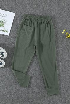 Green Causal Pockets Pants Casual Stretch Capris In Solid Color, Non-stretch Capris With Pockets, Green Casual Pants With Elastic Waistband, Casual Green Pants With Elastic Waistband, Green Casual Bottoms, Trendy Summer Harem Pants With Pockets, Casual Green Bottoms, Summer Khaki Pants With Side Pockets, Khaki Summer Pants With Side Pockets