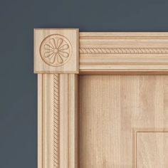 an unfinished door frame with a flower decoration on the front and side panel, made out of wood