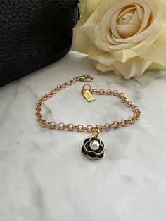 A single black camellia rose with a faux pearl center. Dainty and chic. This charm bracelet can be customized to match your bag charm as well, and the length can be adjusted. Please message me for custom requests. Bridesmaids Gifts, Gift Item, You Bag, Faux Pearl, Wedding Gifts, Etsy Accessories, Bathing Beauties, Charm Bracelet, Gift Card