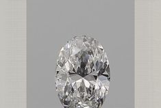 an oval cut diamond is shown in this image, it looks to be the centerpiece for