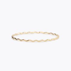 This wavy design was inspired by the gold edges of Susan Gordon’s signature handmade pottery. A collaboration piece between SGP and Yearly Co. perfect for representing the ups and downs in life. A 1.8mm round, solid 14k gold bangle.If you want to customize a Wavy Bangle with diamonds, email us at hello@yearlyco.com. Minimalist 14k Gold Wavy Jewelry, Adjustable Wavy Stackable Jewelry, Gold Wavy Jewelry For Everyday, Everyday Yellow Gold Wavy Jewelry, Adjustable Stackable Wavy Jewelry, Minimalist Wavy Yellow Gold Jewelry, Everyday Wavy Yellow Gold Jewelry, Ups And Downs In Life, Bangle With Diamonds