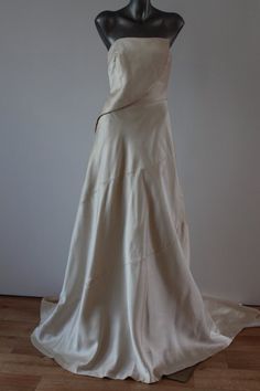 a white wedding dress on a mannequin