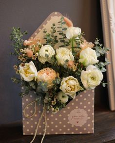 a bouquet of flowers sitting on top of a card