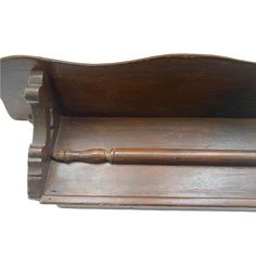 an old wooden shelf with a handle on it