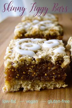 two pieces of cake sitting on top of a wooden cutting board