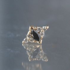 a black diamond ring sitting on top of a table