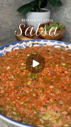 an image of salsa in a blue and white bowl with the title restaurant style salsa