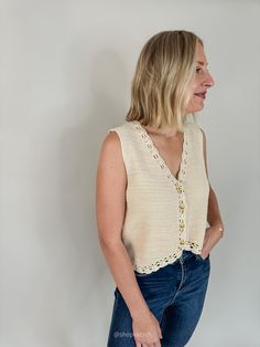 Crafted from a soft, high-quality knit, this neutral sweater vest offers a relaxed fit that’s both flattering and comfortable. The highlight of this piece is the delicate crochet trim, which adds a unique, handcrafted touch to the classic button-down design. Available in small, medium, large, extra large Color: Oatmeal Gold buttons Semi-sheer Crochet edging V neckline Sleeveless 88% Viscose, 12% Nylon Paired here with our Shake it Off High Rise Stretch Slim Straight denim ** ALL CLEARANCE ITEMS Neutral Sweater, Crochet Button, Delicate Crochet, Neutral Sweaters, Crochet Buttons, Shake It, Down Vest, Shake It Off, Crochet Edging