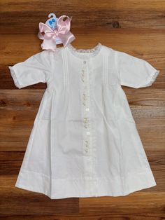 The Kelly Daygown Girl is the perfect option for bringing a touch of elegance to any little girl's wardrobe. This daygown is made from a softly woven cotton fabric and features ruffles and floral embroidery for the ideal blend of sophistication and comfort. 120423bb Girls Wardrobe, Woven Cotton, Cotton Weaving, Floral Embroidery, Front Porch, Clothing And Shoes, Ruffles, Baby Clothes