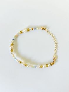 Beaded Bracelet   Hand beaded - real fresh water pearls and seed beads It is not recommended to wear bracelets or necklaces in water - swimming, showering etc.   Delicate - handle with care Adjustable in size! Summer Gold Beaded Pearl Bracelet, Adjustable Pearl Bracelet With Tiny Beads, Beach Pearl Bracelet With Pearl Charm, Adjustable Beaded Pearl Bracelet For Summer, Summer Beach Pearl Bracelet, Pearl Beaded Bracelets With Pearl Charm For Beach, Beach Beaded Bracelets With Pearl Charm, Adjustable Pearl Bracelet With Gold Beads, Summer Pearl Beaded Bracelets For Beach