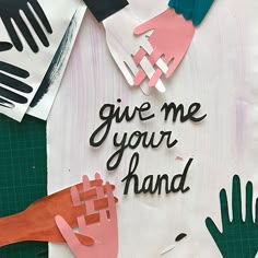 paper cutouts with hand prints and words on them that say give me your hand