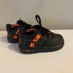 Brand: Nike Department: Toddler Boys Shoes Size:7c Color: Black And Orange Style: Low Top Closure: Shoe String Pattern: Black With Orange Accents Condition: Nwot Ships Fast Comes From Smoke Free Home Orange Low-top Sneakers With Elastic Laces, Orange Training Sneakers With Rubber Sole, Nike Scratch-resistant Running Sneakers, Orange Non-slip Sneakers With Round Toe, Orange Non-slip Sneakers For Sports, Non-slip Orange Sneakers For Sports, Orange Low-top Basketball Shoes For Training, Low-top Orange Basketball Shoes For Training, Black Scratch-resistant Training Sneakers