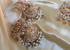 A must have for the upcoming wedding season! This bridal set is a unique blend of royal and modern with its pastel hues and gold plating. The set is gorgeous with pearls and is a full bridal piece but can be worn separately for a lighter and simple look. Set includes: mala , earrings, maang tikka , passa, choker In stock and ready to ship‰Û? Gold Festive Sets For Marriage, Elegant Gold Sets With Stone Work, White Jhumkas For Wedding, White Jhumkas For Wedding And Eid, Chandbali Pearl Bridal Necklace For Wedding, Tilla Bridal Earrings For Eid Wedding, Elegant Kundan Bridal Sets For Eid, Tilla Bridal Earrings For Wedding And Eid, Tilla Bridal Earrings For Wedding During Eid