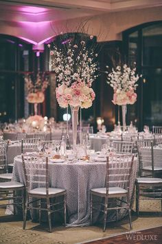 the wedding website is displayed with photos and flowers in vases on top of tables