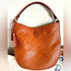 Tory Burch, Thea Woven Bucket Hobo Handbag, Camel Leather Woven And Suede Accents, Excellent Used Condition, Does Have Small Spot On The Bottom, Perfect For Fall! Tan Woven Leather Bag For Everyday Use, Tan Woven Leather Travel Bag, Luxury Tan Shoulder Bag With Braided Handles, Designer Tan Bag With Braided Handles, Designer Tan Bags With Braided Handles, Tan Bag With Braided Handles For Errands, Tan Bags With Braided Handles For Errands, Tan Shoulder Bag With Braided Handles For Errands, Elegant Tan Bags With Braided Handles