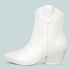 Step into western chic style with these white ankle-length cowboy boots. Featuring intricate embroidered details and a comfortable block heel, they're perfect for adding a touch of flair to any outfit. Color: White Heel Type: Block heel Heel height: 2.36" / 60 mm approx Product measurements were taken using size 8. Please note that measurements may vary by size. Toe: Almond toe Patchwork Detailing Embroidery embellishment Slip-on and pull tab design Handcrafted US sizing. Fits true to size. White Boots For Western-themed Events, White Boots For Western-themed Fall Events, White Pointed Toe Boots For Western-themed Events, White Pointed Toe Mid-calf Boots For Spring, White Round Toe Heeled Boots For Western Events, White Heeled Boots For Fall Rodeo, White Heeled Boots For Rodeo In Fall, Western White Boots With Stacked Heel, White Western Boots For Western-themed Events