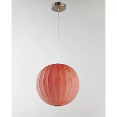 a red ball shaped light hanging from a ceiling