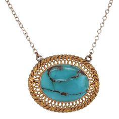 This is part of Chairish’s Fine Jewelry assortment.  A fine repurposed Victorian period 14K gold pendant with a natural polished turquoise in the center.  The bezel set stone is surrounded by a gold filigree frame.  The chain is marked 14K and is the adjustable type which allows you to wear it two inches shorter.  Condition is excellent.  The back of the pendant also has an applied small plaque stamped 14K.  It dates c. 1890.  Dimensions: 18" or 16", Pendant: Width: 1", Length: 3/4", Weight:  5. Gold Oval Turquoise Gemstone Necklace, Antique Oval Turquoise Necklace, Antique Turquoise Oval Necklace, Gold Turquoise Pendant Necklace With Cabochon, Elegant Gold Turquoise Necklace With Oval Pendant, Elegant Oval Turquoise Necklace With Large Pendant, Filigree Frame, Victorian Period, Gold Filigree