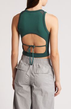 This cool cropped tank is crafted in a close-fitting silhouette with a tied-and-cutout back. 15" length (size Medium) Ties at back Crewneck Sleeveless 38% polyester, 35% recycled polyamide, 21% polyamide, 6% elastane Machine wash, line dry Made in Turkey Spring Fitted Top With Cutout Back, Fitted Top With Cutout Back For Spring, Spring Stretch Tops With Lace-up Back, Sleeveless Top With Lace-up Back For Spring, Chic Sleeveless Tank Top With Cutout Back, Chic Sleeveless Cutout Back Tank Top, Casual Backless Tank Top With Tie Back, Spring Backless Top With Lace-up Back, Casual Backless Tie Back Tank Top