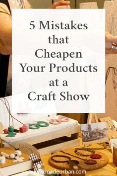 a table filled with crafts and craft supplies on top of a wooden table next to other items