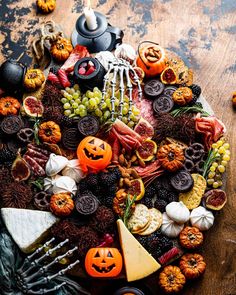 a table topped with lots of halloween food