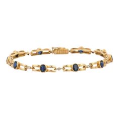 Blue Sapphire bracelet in 18K Gold. It has a perfect oval cut gemstone to make you stand out on any occasion or an event. A tennis bracelet is an essential piece of jewelry when it comes to your wedding day. The sleek and elegant style complements the attire beautifully, whether it's the bride wearing it herself, or as a gift to her bridesmaids to wear on the D’day.  Bracelets are worn to enhance the look. Women love to look good. It is common to see a woman rocking a lovely gold bracelet on her wrist. A gold gemstone bracelet is the ultimate statement piece for every stylish woman.  PRODUCT DETAILS :-  > Material - 18K Solid Yellow Gold > Gemstone - Blue Sapphire  > Stone Weight - 8.5 ct > Stone Shape - Oval  > Stone Pcs - 10  > Stone Size - 5 x 4 mm > Diamond Weight - 0.15 ct  > Diamond Luxury Oval Diamond Bracelet With Gemstone, Classic Diamond Gemstone Bracelet For Formal Occasions, Classic Gemstone Diamond Bracelet For Formal Occasions, Classic Diamond Bracelet With Gemstone For Formal Occasions, Classic Formal Diamond Bracelet With Gemstone, Luxury Blue Oval Diamond Bracelet, Luxury Oval Gemstone Bracelet, Classic Oval Diamond Bracelet For Formal Occasions, Timeless Oval Link Diamond Bracelet For Formal Occasions