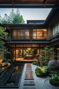 the inside of a house with lots of plants and trees in it's yard