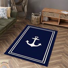 a blue rug with an anchor on it in a living room next to a couch